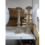 A PAIR OF HEAVY CAST METAL CANDLESTICKS, 45CM HIGH