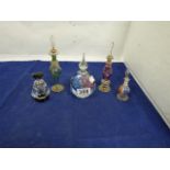FIVE GLASS PERFUME BOTTLES OF VARYING SHAPES AND SIZES