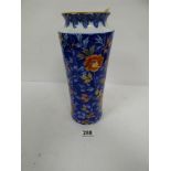 A LARGE JAPANESE PORCELAIN VASE WITH BLUE, WHITE, RED AND GOLD DECORATION IN FLORAL MOTIFS, THREE