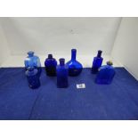 SEVEN BLUE GLASS BOTTLES INCLUDING ONE IN THE ATYLE OF ART NOUVEAU