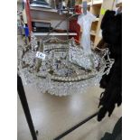 A LARGE GLASS HANGING CHANDELIER OF DOMED FORM WITH HANGING GLASS DROPLETS