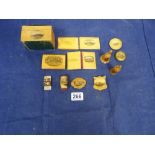 A COLLECTION OF WOODEN TREEN ITEMS, INCLUDING ADVERTISING NEEDLE CASES, PIN CUSHIONS, PIN BADGES AND