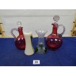 TWO VICTORIAN CRANBERRY GLASS DECANTERS AND TWO ART NOUVEAU GLASS VASES