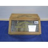 A 20TH CENTURY SMALL WOODEN AND GLASS FRONTED SHOP ADVERTISING DISPLAY BOX, THE FRONT READING "