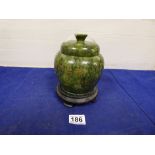 JAPANESE GREEN MARBLE LIDDED POT ON WOODEN STAND, WIDTH 15CM