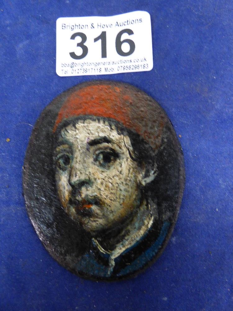 AN OVAL PORTRAIT MINIATURE OF A BOY, PAINTED ON A LEATHER LIKE MATERIAL, UNFRAMED, 7.5CM BY 6CM