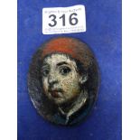 AN OVAL PORTRAIT MINIATURE OF A BOY, PAINTED ON A LEATHER LIKE MATERIAL, UNFRAMED, 7.5CM BY 6CM