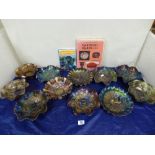 QUANTITY OF CARNIVAL GLASS BOWLS, EACH WITH FRILLED EDGES AND SOME RAISED ON FEET, LARGEST 23CM