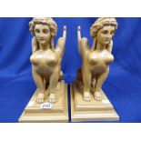 A PAIR OF UNUSUAL SPHINX' IN RESIN TERRACOTTA IN COLOUR 35 CMS