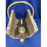 A 20TH CENTURY CARVED WOODEN WALL BAROMETER, 59CM LONG, TOGETHER WITH A BASKET WITH SINGLE HANDLE TO