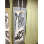 AN ORIENTAL JAPANESE CHINESE WALL HANGING OF A WATERFALL AND TREES AND BEARING SIGNATURE, DROP 184