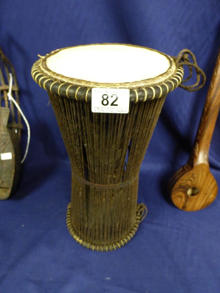 A DOUBLE SIDED AFRICAN TRIBAL DRUM WITH PEA’S INSIDE WHICH RATTLE WHEN MOVED, 43CM HIGH, TOGETHER - Image 2 of 10