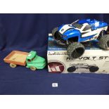 A REVOLT ST-10 REMOTE CONTROLLED ELECTRIC POWERED 4WD STADIUM TRUCK, 1/10 SCALE, IN ORIGINAL BOX,