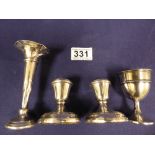 A PAIR OF SILVER SQUAT CANDLESTICKS, A SILVER EGGCUP AND A SILVER SPILL VASE, TOTAL WEIGHT 129G