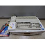 AN AMIGA COMMODORE MODEL 500 IN ORIGINAL BOX