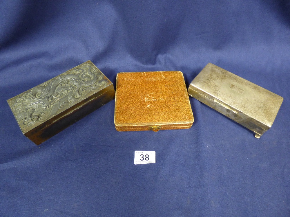 TWO CIGARETTE BOXES, ONE BRONZE WITH DRAGON MOTIF TO TOP, THE OTHER SILVER PLATED BY ARISTOCRAT,