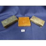 TWO CIGARETTE BOXES, ONE BRONZE WITH DRAGON MOTIF TO TOP, THE OTHER SILVER PLATED BY ARISTOCRAT,