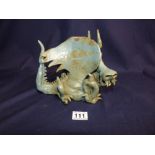 AN ABSTRACT CERAMIC FIGURE OF A DRAGON IN A SEATED POSITION, 25CM IN LENGTH (AF)