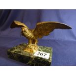 A GILDED BRONZE FIGURE OF AN EAGLE ABOUT TO TAKE FLIGHT, RAISED UPON A MARBLE BASE, 20CM WIDE