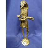 A BRONZE SCULPTURE OF A SLENDER MIDDLE EASTERN MAN PLAYING A STRINGED INSTRUMENT, 35CM HIGH