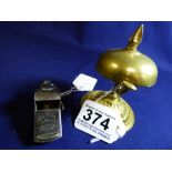 A 20TH CENTURY GILT BRASS TABLE BELL, 9CM HIGH, TOGETHER WITH “THE ACME THUNDERER” WHISTLE, MADE