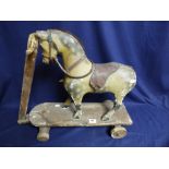 A LATE 19TH CENTURY WOODEN PULL ALONG HORSE, 53CM HIGH BY 65CM WIDE