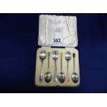 A SET OF SIX SILVER TEASPOONS WITH COLOURED ENAMEL ENDS TO THE HANDLES, HALLMARKED BIRMINGHAM 1936