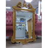 AN EARLY 20TH CENTURY GILT WOOD WALL MIRROR WITH ORNATELY CARVED ACANTHUS LEAF MOTIF’S SURROUNDING