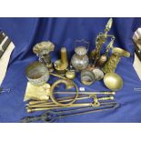 BOX OF BRASS ITEMS INCLUDING FIRE IRONS AND AN OIL LAMP