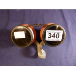 A PAIR OF VINTAGE AVIATOR AVIATION GOGGLES WITH FLIP UP LENSES AND ELASTIC STRAP TO BACK