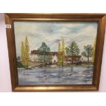 A GILT FRAMED OIL ON CANVAS OF A LARGE HOUSE OR FACTORY BESIDE A LAKE SIGNED JIRARD TO THE BOTTOM