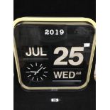 A VINTAGE QUARTZ WALL CLOCK OF RECTANGULAR FORM WITH DAY, DATE, MONTH AND YEAR DISPLAYS, 42CM