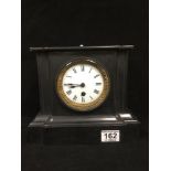 A LATE 19TH/EARLY 20TH CENTURY SLATE CLOCK, THE ENAMEL DIAL WITH ROMAN NUMERALS DENOTING HOURS, 24.