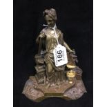 A BRONZE FIGURE OF A MYTHOLIGICAL GODDESS, HOLDING A HAMMER RESTING ON AN ANVIL IN HER RIGHT HAND,