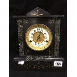 A LATE 19TH/EARLY 20TH CENTURY HEAVY SLATE CLOCK, THE FRONT WITH INLAID GILT AND MARBLE ACCENTS, THE