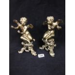 A PAIR OF 19TH CENTURY FRENCH GILT BRONZE FIGURES OF SEATED CHERUBS ON TRIFORM BASES, 25CM IN