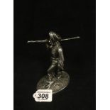 A WHITE METAL FIGURE OF AN ARABIAN MAN CARRYING A LARGE STICK UPON HIS RIGHT SHOULDER, UNMARKED,