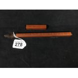 A CHINESE BAMBOO CALLIGRAPHY BRUSH WITH ETCHED CHARACTER MARKS TO TWO SIDES, 29CM LONG