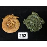 TWO CHINESE CARVED HARD STONE PLAQUES OF CIRCULAR FORM