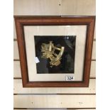 A SMALL BRASS SEXTANT MOUNTED IN GLAZED WOODEN FRAME, 31CM DIAMETER