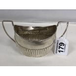 A VICTORIAN SILVER TWIN HANDLED HALF FLUTED SUGAR BOWL OF OVAL FORM, HALLMARKED BIRMINGHAM 1889,