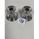 A PAIR OF SILVER SQUAT CANDLESTICKS, HALLMARKED BIRMINGHAM 1918 BY CHARLES BOYTON & SON LTD