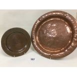 AN ARTS AND CRAFTS HAMMERED COPPER TRAY OF CIRCULAR FORM BY LOMBARD ENGLAND, 35CM DIAMETER, TOGETHER