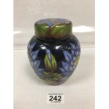 A MODERN MOORCROFT LIDDED POT WITH BLUE LOTUS DECORATION, SIGNED AND DATED 2009 BY RACHEL BISHOP,