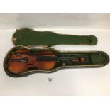 A THREE QUARTER SIZE MAHOGANY VIOLIN WITH BOW IN ORIGINAL CASE (AF)