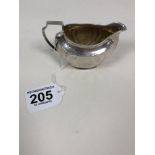 AN EDWARDIAN SILVER OVAL CREAM JUG, HALLMARKED SHEFFIELD 1906 BY ATKIN BROTHERS, 96G