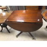 MAHOGANY DROP LEAF TABLE ON PEDESTAL BASE WITH ORIGINAL CASTORS