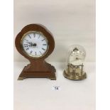 A KUNDO ANNIVERSARY CLOCK WITH DOME, MADE IN GERMANY, TOGETHER WITH A WOODEN CASED QUARTZ MANTLE