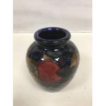 A SMALL WILLIAM MOORCROFT VASE "POMEGRANATE" PATTERN, 8CM HIGH (AF)