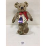 A MERRYTHOUGHT LIMITED EDITION MOHAIR TEDDY BEAR MADE EXCLUSIVELY FOR HARRODS, EDITION 669 OF